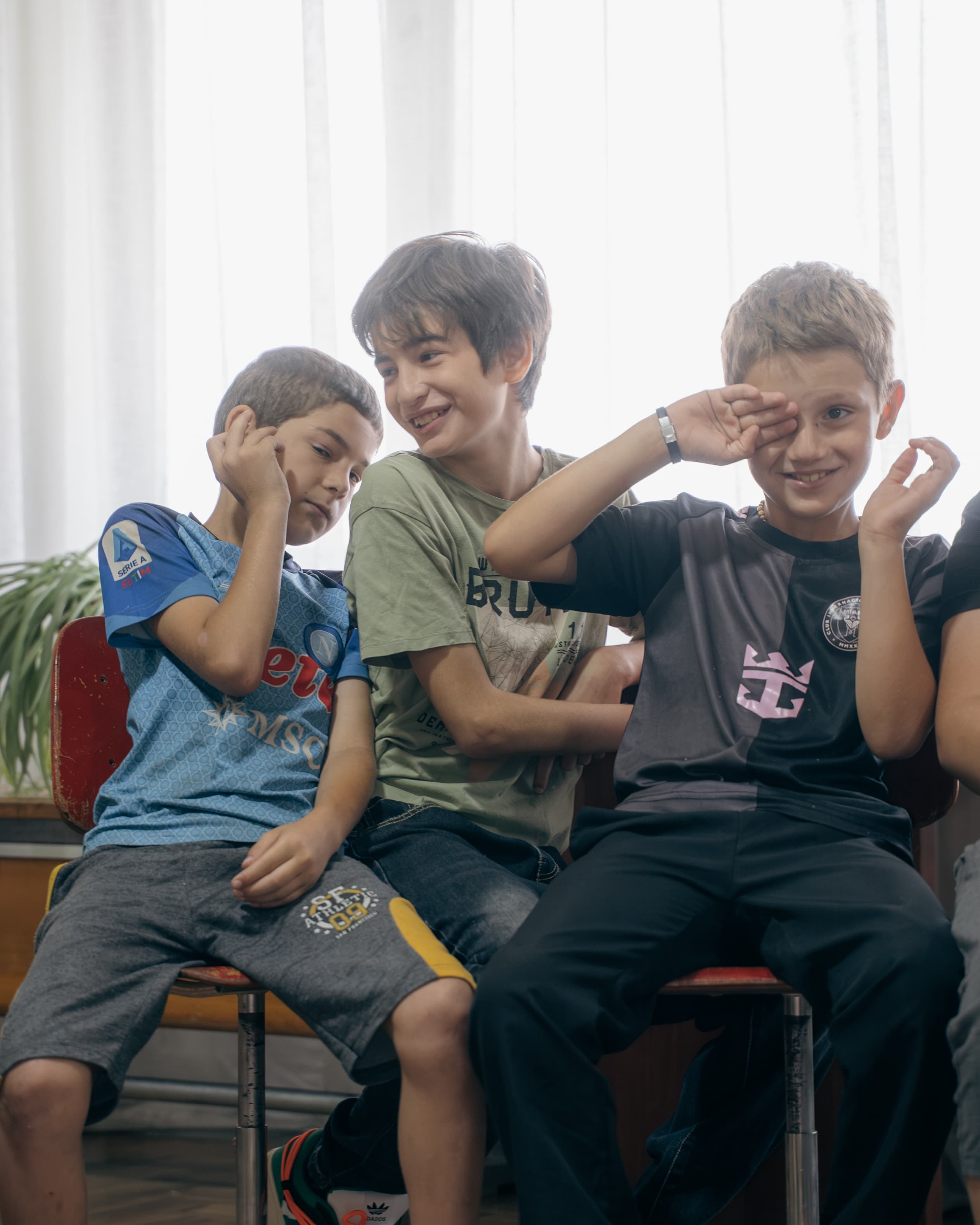 Boys laughing together at Society Biliki