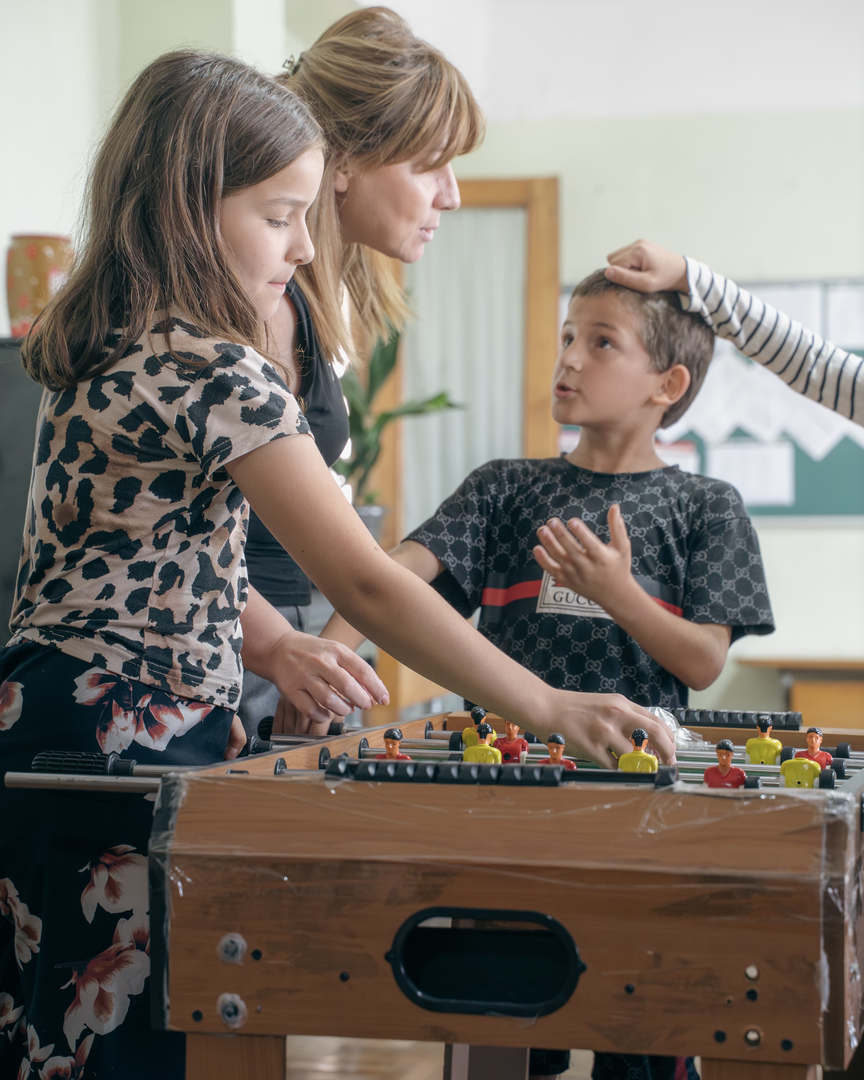 Kids playing table football at Society Biliki
