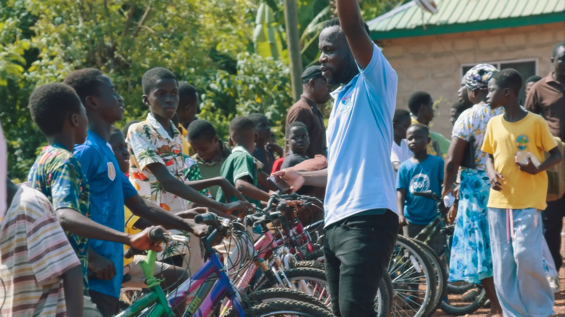 Kids gathering around the bikes as they are handed out
